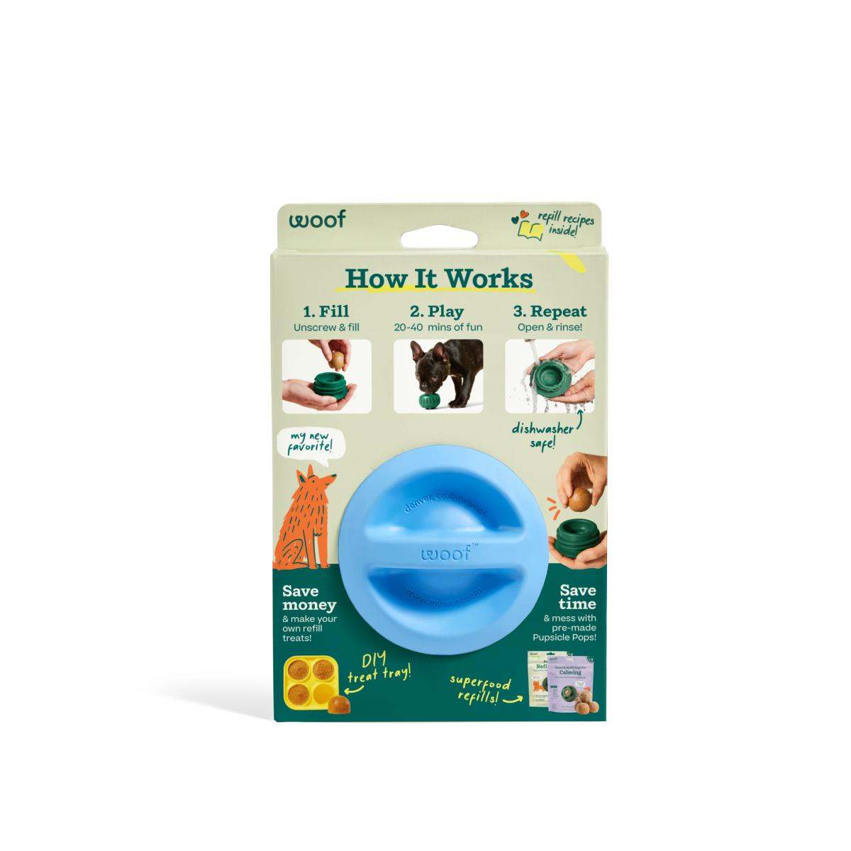 Pupsicle dog enrichment toy, blue non-toxic rubber sphere with a central slot, displayed in a cardboard package.