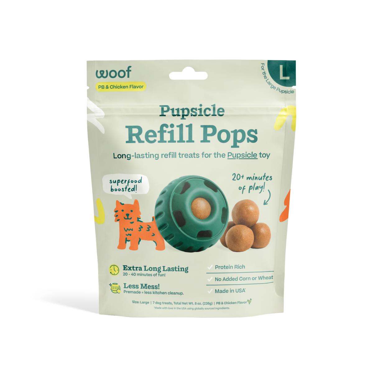 Pupsicle Pops refill treats in a pale green pouch with teal lettering, featuring a green toy and tan round treats.