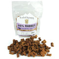Rabbit Training Bites are small, brown, bone-shaped dog treats made from 95% rabbit meat in a clear resealable bag.
