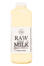 Goat Milk in a clear plastic bottle, pale cream liquid, white label with bold black lettering and screw cap