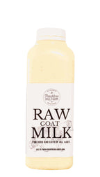 Raw Goat Milk in a translucent bottle with a white cap and cream label featuring bold brown lettering.