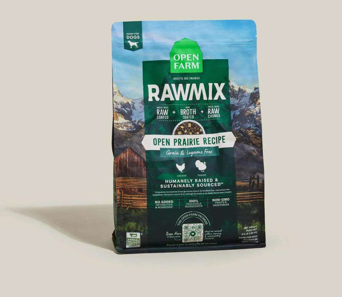Dog kibble in a dark green and blue bag, RawMix Open Prairie recipe with mountain scenery and grain-free labeling.