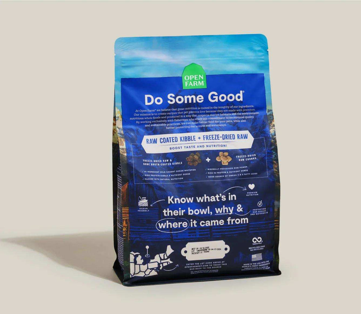 Dog kibble bag labeled RawMix Wild Ocean, with a blue package, green Open Farm logo, and white lettering.