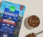 Dog kibble in brown crunchy morsels, with a blue RawMix Wild Ocean ancient grains recipe bag and freeze-dried chunks.