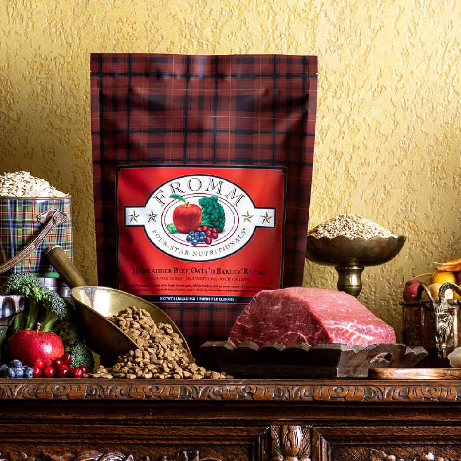 Four-Star Beef Oats & Barley dog food packaging with fresh beef, oats, barley, and vegetables ingredients on wooden table