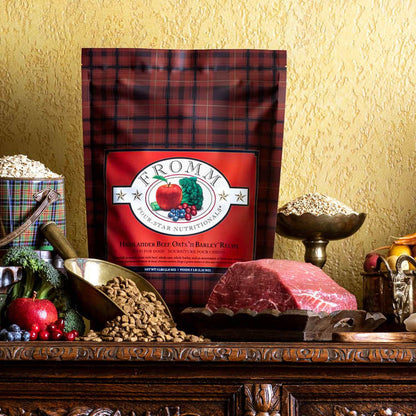 Four-Star Beef Oats & Barley dog food packaging with fresh beef, oats, barley, and vegetables ingredients on wooden table