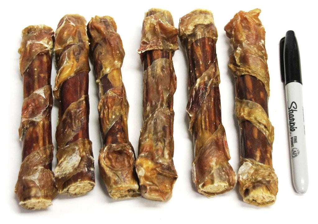 Tremenda Chewy Bulls natural beef dog chew treats wrapped in dehydrated beef bladder next to a black Sharpie marker for size comparison