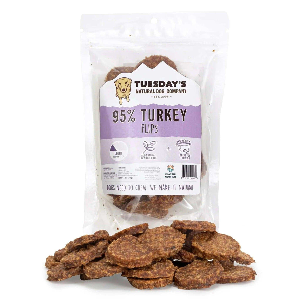 Turkey Flips dog treats, brown irregularly shaped pieces with a rough, textured appearance in a clear resealable bag.