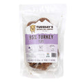Turkey Flips dog treats in a clear resealable pouch, showing brown, textured turkey pieces and a purple-and-white label.