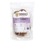 Turkey Flips dog treats in a clear resealable pouch, showing brown, textured turkey pieces and a purple-and-white label.