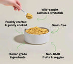 Dog food, Wild-Caught Fish with shredded golden-brown salmon and whitefish in a white bowl, freshly crafted and grain-free