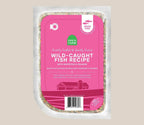 Wild-Caught Fish dog food in a clear sealed tray with a bright pink label, white text and grain-free badge.